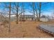 House and backyard view with trampoline at 65 Centerport Dr, White, GA 30184