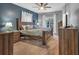 Spacious bedroom with king-size bed and wood furniture at 65 Centerport Dr, White, GA 30184