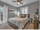 Bedroom with queen-size bed and window at 65 Centerport Dr, White, GA 30184
