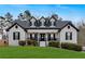 House with white brick exterior, black shutters at 65 Centerport Dr, White, GA 30184