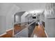 Bright loft with hardwood floors and a railing overlooking the lower level at 65 Centerport Dr, White, GA 30184