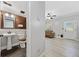 Bathroom and living room showcase a seamless blend of style and functionality, creating a unified space at 1131 Orr Rd, Jonesboro, GA 30238