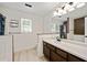 Bathroom with modern vanity, large mirror, tub/shower, wood-look floors, neutral walls and bright lighting at 1131 Orr Rd, Jonesboro, GA 30238