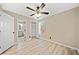 Bedroom featuring a ceiling fan, wood-look floors, closet, and ensuite bathroom at 1131 Orr Rd, Jonesboro, GA 30238