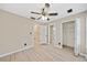 Spacious bedroom features wood-look floors, a ceiling fan, closet space, and white trim at 1131 Orr Rd, Jonesboro, GA 30238