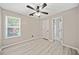 Bedroom features wood-look floors, ceiling fan, and a window at 1131 Orr Rd, Jonesboro, GA 30238