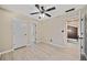Bedroom with ceiling fan, white walls, wood-look floors, and entry doorway at 1131 Orr Rd, Jonesboro, GA 30238