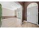 Entryway leading to dining room with light wood floors and neutral two-tone paint at 1131 Orr Rd, Jonesboro, GA 30238