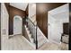 Welcoming foyer with staircase, light wood floors, neutral walls and a front door with transom at 1131 Orr Rd, Jonesboro, GA 30238