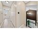 Bright hallway featuring wood-look floors, closet doors, and view of the foyer and room with a ceiling fan at 1131 Orr Rd, Jonesboro, GA 30238