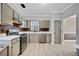 Kitchen featuring stainless steel appliances, gray cabinets, white countertops and gray walls at 1131 Orr Rd, Jonesboro, GA 30238