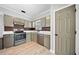 Kitchen featuring stainless steel appliances, gray cabinets, white countertops and gray walls at 1131 Orr Rd, Jonesboro, GA 30238