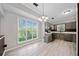 Kitchen featuring stainless steel appliances, gray cabinets, white countertops and natural light at 1131 Orr Rd, Jonesboro, GA 30238