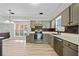 Kitchen with stainless steel appliances, gray cabinets, white countertops and natural light at 1131 Orr Rd, Jonesboro, GA 30238