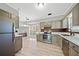 Kitchen with stainless steel appliances, gray cabinets, white countertops and natural light at 1131 Orr Rd, Jonesboro, GA 30238
