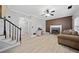 Inviting living room showcases a fireplace and seamless transition to the upper level via the staircase at 1131 Orr Rd, Jonesboro, GA 30238