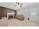 Comfortable living room with a stone fireplace, neutral color palette, and a view of the backyard at 1131 Orr Rd, Jonesboro, GA 30238