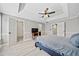 Spacious main bedroom with light gray walls, white trim, tray ceiling, ceiling fan, and light wood-look flooring at 1131 Orr Rd, Jonesboro, GA 30238