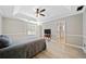 Bright main bedroom with tray ceiling and fan includes light walls, white trim, wood-look floors, and ensuite access at 1131 Orr Rd, Jonesboro, GA 30238