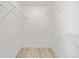 Walk-in closet with ample storage includes light walls and wood-look flooring with multiple wire shelving units at 1131 Orr Rd, Jonesboro, GA 30238