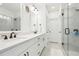 Double vanity bathroom with a frameless shower at 6829 Crescendo Ct, Atlanta, GA 30328