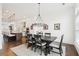 Open concept dining area with a view into a modern kitchen at 6829 Crescendo Ct, Atlanta, GA 30328