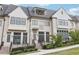 Beautiful townhome with a light-colored brick facade and a well-manicured lawn at 6829 Crescendo Ct, Atlanta, GA 30328