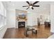 Living room features a cozy fireplace and is open to the kitchen at 6829 Crescendo Ct, Atlanta, GA 30328