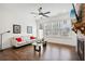 Spacious living room with hardwood floors, a ceiling fan, and comfortable seating at 6829 Crescendo Ct, Atlanta, GA 30328