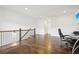 Spacious loft area with hardwood floors and a view of the staircase at 6829 Crescendo Ct, Atlanta, GA 30328