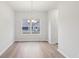 Bright dining room with hardwood floors and a chandelier at 1391 Stephens View Dr, Loganville, GA 30052