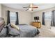 King-size bedroom with ceiling fan and neutral-toned bedding at 1430 Wisdom Way, Austell, GA 30106