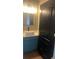 Stylish bathroom featuring blue vanity with sleek sink and fixtures at 3236 Tallon Sw Ln, Atlanta, GA 30311