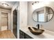 Modern bathroom showcasing a unique black vessel sink and marble countertop at 3236 Tallon Sw Ln, Atlanta, GA 30311