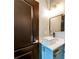 Bathroom featuring a modern square sink on blue vanity with matte black faucet and square mirror at 3236 Tallon Sw Ln, Atlanta, GA 30311