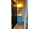 Stylish bathroom with a blue vanity, white sink and modern fixtures at 3236 Tallon Sw Ln, Atlanta, GA 30311