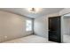 Cozy bedroom featuring neutral decor and a large window for natural light at 3236 Tallon Sw Ln, Atlanta, GA 30311
