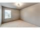 Bright bedroom with plush carpeting, a window and neutral walls at 3236 Tallon Sw Ln, Atlanta, GA 30311
