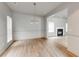 Bright dining room featuring wood floors, a modern chandelier, and an open layout to the living spaces at 3236 Tallon Sw Ln, Atlanta, GA 30311