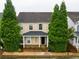 Charming two-story home with manicured front yard and inviting entrance and green trees at 3236 Tallon Sw Ln, Atlanta, GA 30311