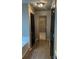 Hallway featuring modern lighting fixtures, neutral paint, and access to multiple rooms at 3236 Tallon Sw Ln, Atlanta, GA 30311