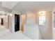 Upstairs hallway with neutral carpet, black doors, and a staircase landing at 3236 Tallon Sw Ln, Atlanta, GA 30311