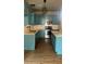 Bright kitchen featuring modern blue cabinets, stainless steel appliances, and attractive countertops at 3236 Tallon Sw Ln, Atlanta, GA 30311