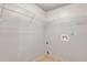 Unfinished laundry room with white wire shelving and hookups for the washer and dryer at 3236 Tallon Sw Ln, Atlanta, GA 30311