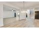 Open-concept living area with hardwood floors and an easy flow to the kitchen and staircase at 3236 Tallon Sw Ln, Atlanta, GA 30311