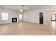 Living room features a fireplace and a large window with luxury vinyl plank flooring at 3236 Tallon Sw Ln, Atlanta, GA 30311