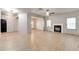 Spacious living area featuring a fireplace, ample natural light, and wood-look floors at 3236 Tallon Sw Ln, Atlanta, GA 30311