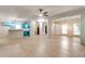 Spacious living area with luxury vinyl plank flooring seamlessly connecting the kitchen and staircase at 3236 Tallon Sw Ln, Atlanta, GA 30311