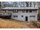 Exterior view of house with deck, patio, and garage in the backyard at 2313 Springdale Sw Rd, Atlanta, GA 30315