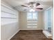 Finished basement room with built-in shelving and wood-look flooring at 3235 Mcafee Rd, Decatur, GA 30032
